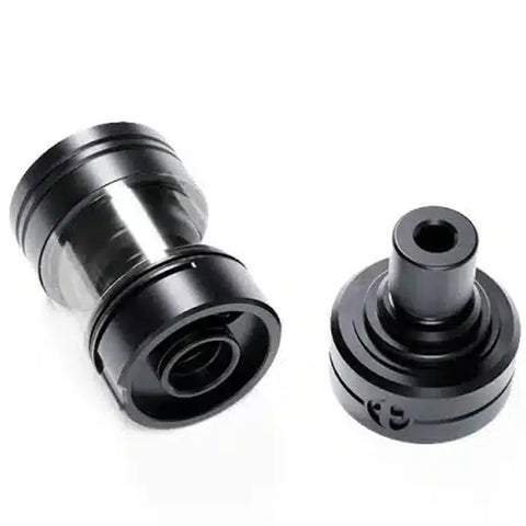 Two black metal mechanical components on a white background